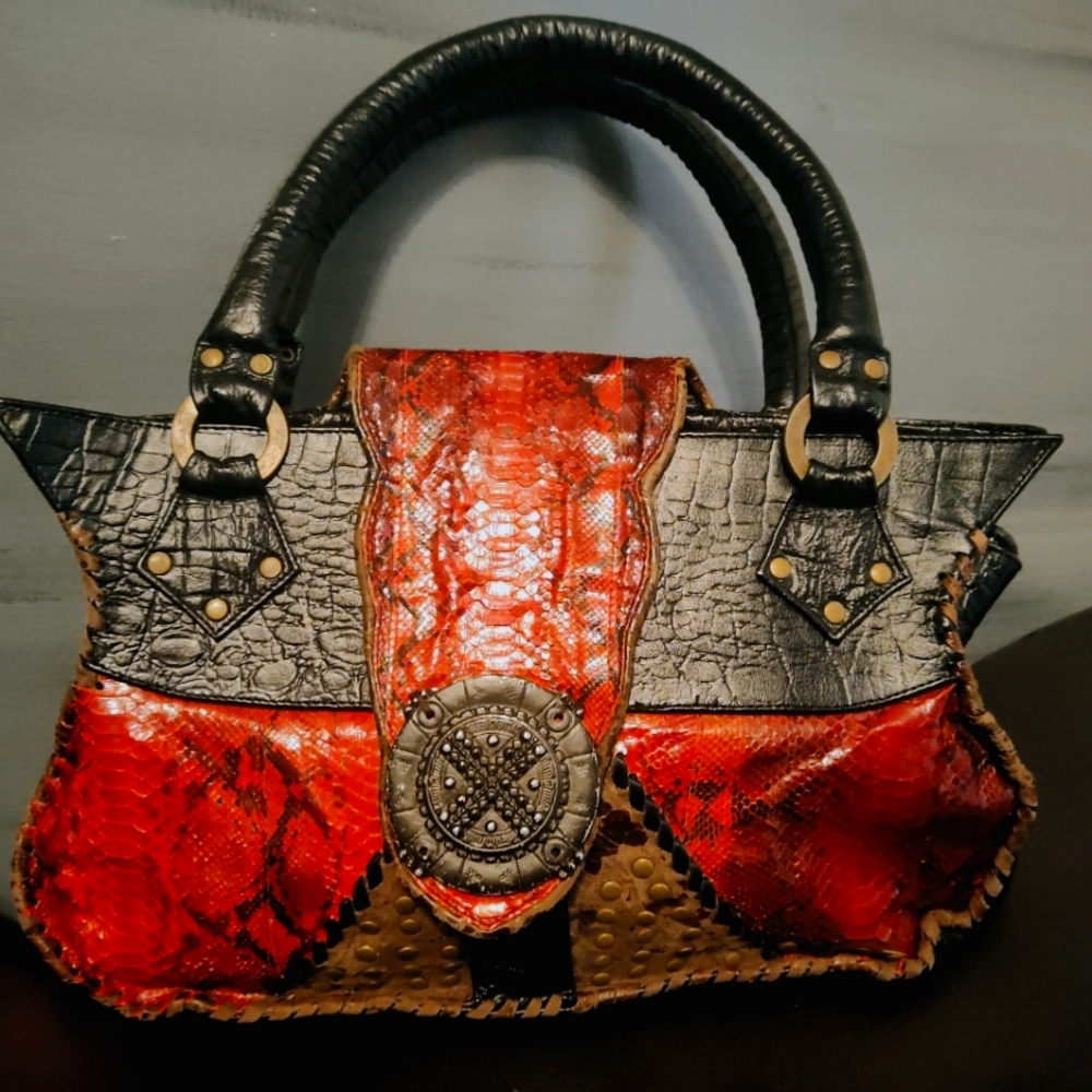 Unique, one of a kind, leather and snake skin bag by Novi Sudiono.